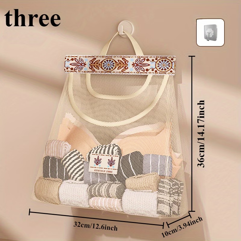 One wall-mounted fabric storage bag with hanging net and hooks.