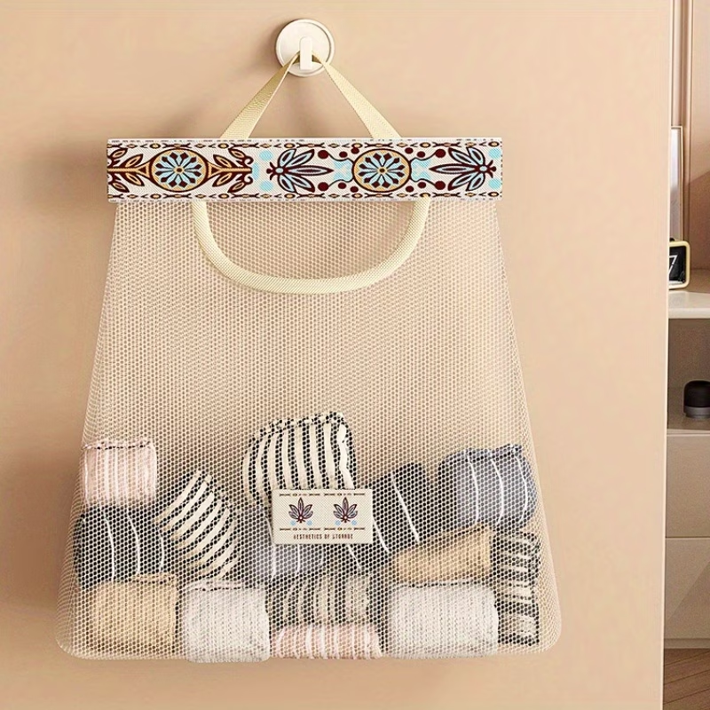 One wall-mounted fabric storage bag with hanging net and hooks.