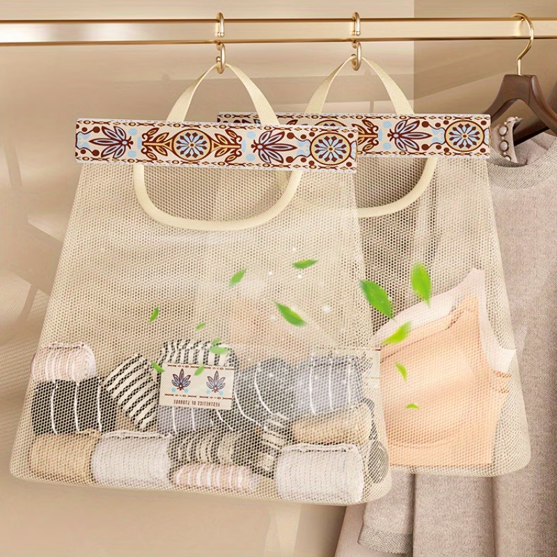 One wall-mounted fabric storage bag with hanging net and hooks.