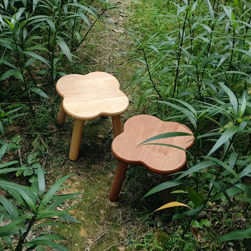 A retro-style creative solid wood clover shoe stool