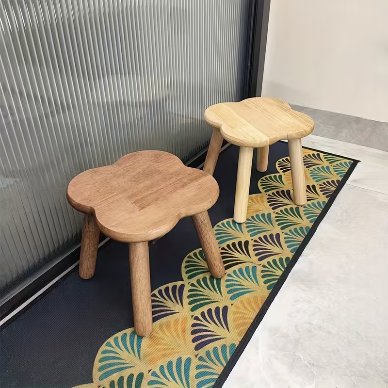 A retro-style creative solid wood clover shoe stool